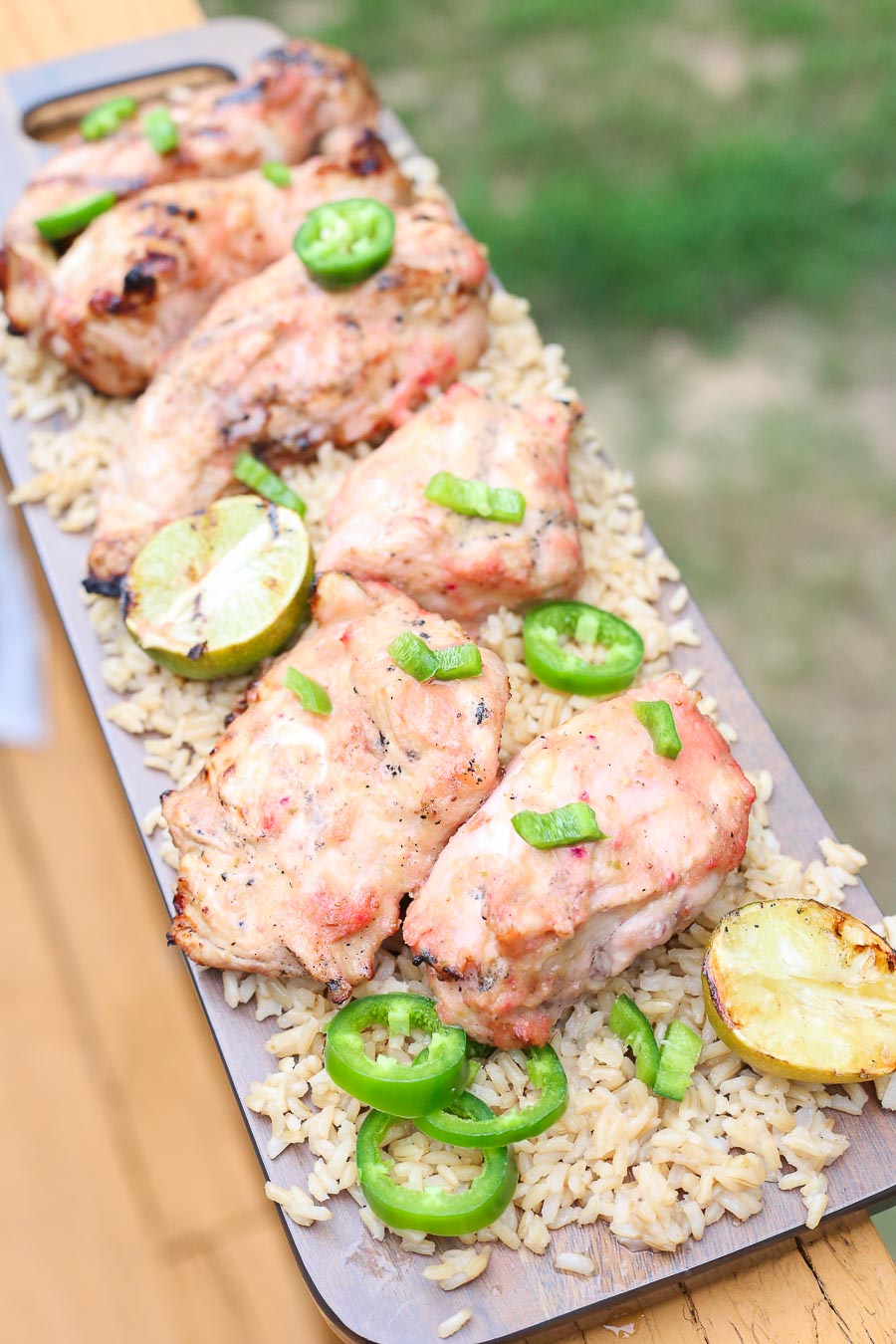 Grilled strawberry mango chicken with fresh jalapenos and grilled lime on a bed of fluffy brown rice!  This healthy delicious meal puts a light tropical flavor in every bite! image 3