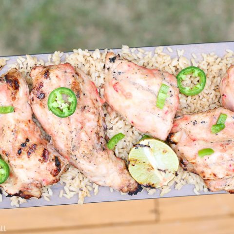 Grilled strawberry mango chicken with fresh jalapenos and grilled lime on a bed of fluffy brown rice!  This healthy delicious meal puts a light tropical flavor in every bite! image 7