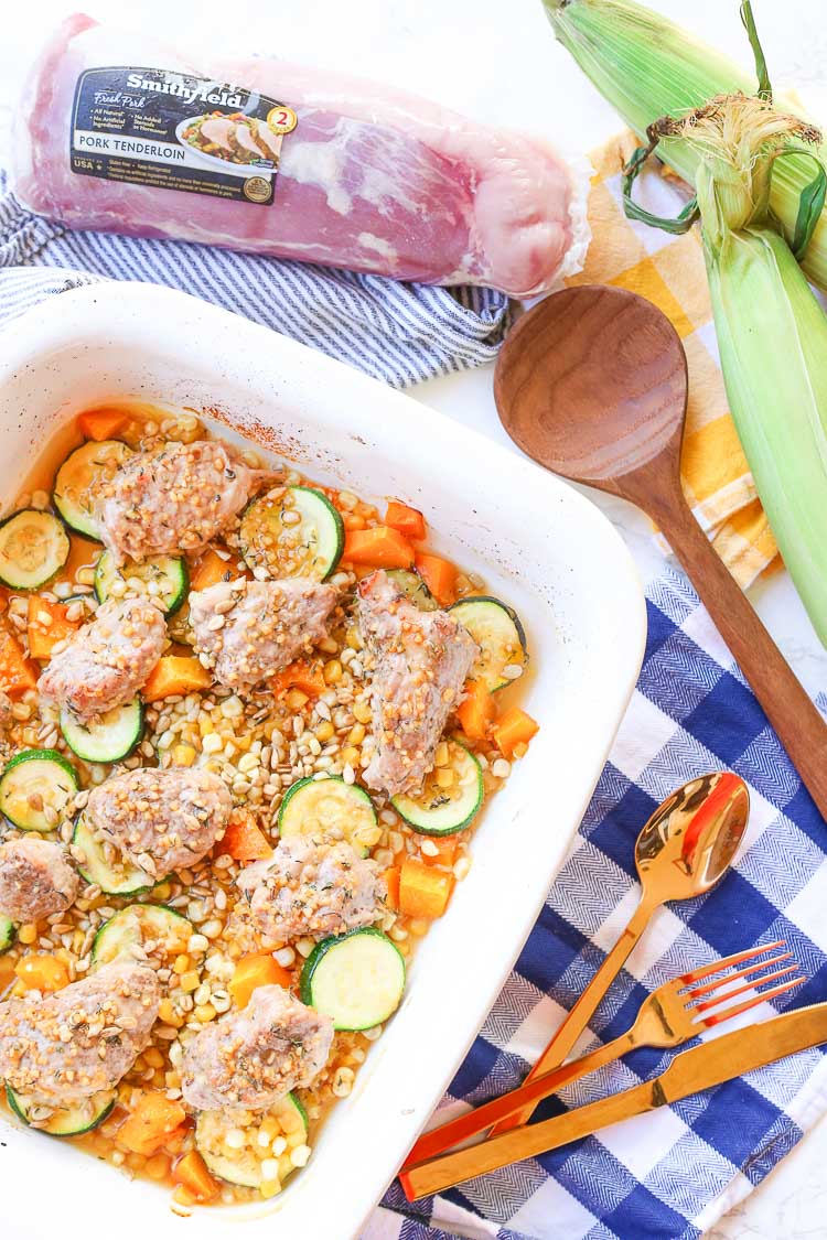 Roasted honey garlic autumn pork and vegetables is a quick and easy weeknight dinner meal prepared in about 30 minutes with real flavor real fast!  Honey garlic sauce is drizzled over seasonal vegetables and juicy pork medallions!