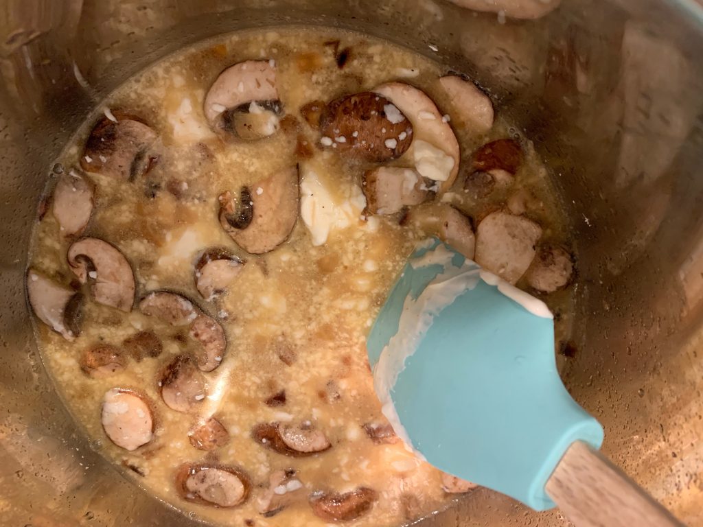 adding cornstarch and mushrooms to gravy for Instant Pot Pork Chops