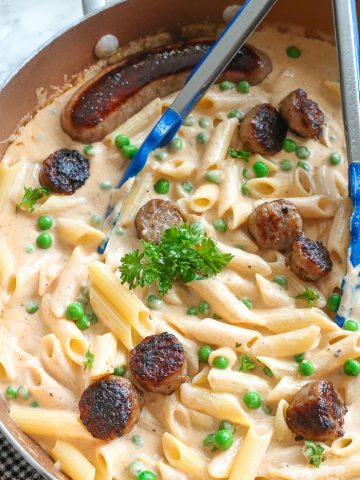 creamy pasta and sauce with bratwurst and parsley