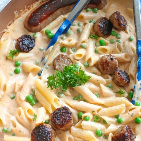 creamy pasta and sauce with bratwurst and parsley
