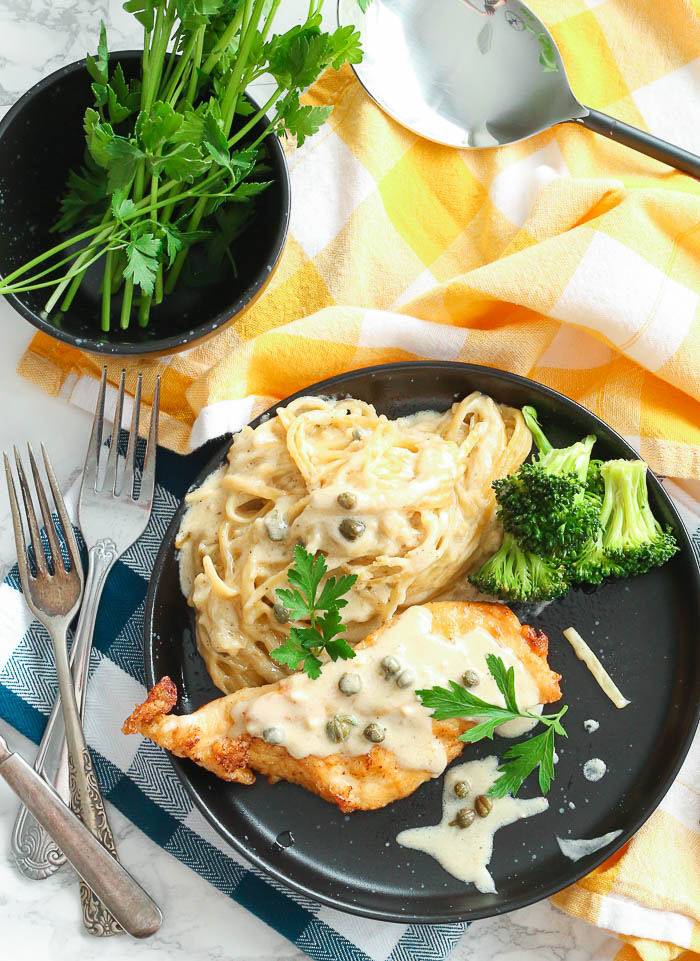 A plate of Chicken Piccata with Creamy Pasta