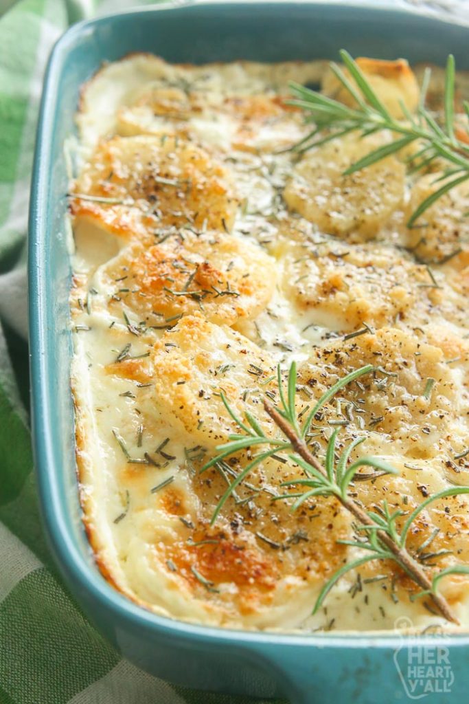 close up of scalloped potatoes in serving spoon