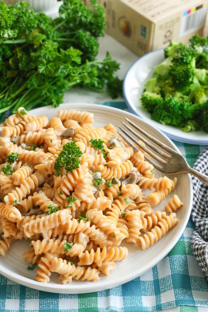 lemon caper rotini pasta in white bowl